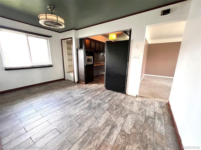 913 Cameron Ave, Pontiac, MI 48340 - kitchen with black appliances, wood finished floors, and dark brown cabinets