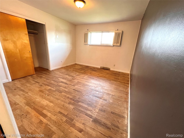 913 Cameron Ave, Pontiac, MI 48340 - unfurnished bedroom featuring wood finished floors and a closet