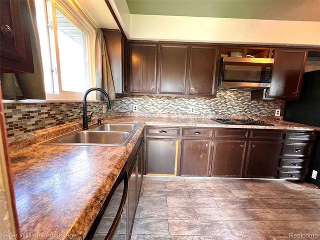 913 Cameron Ave, Pontiac, MI 48340 - kitchen featuring stainless steel appliances, tasteful backsplash, dark brown cabinetry, and light countertops