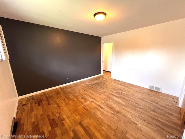 913 Cameron Ave, Pontiac, MI 48340 - empty room with wood finished floors and baseboards