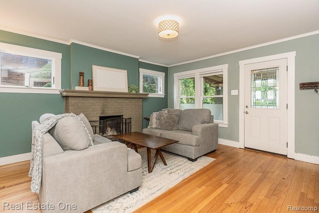 1388 W Troy St, Ferndale, MI 48220 - living area featuring wood finished floors, a fireplace, crown molding, and plenty of natural light