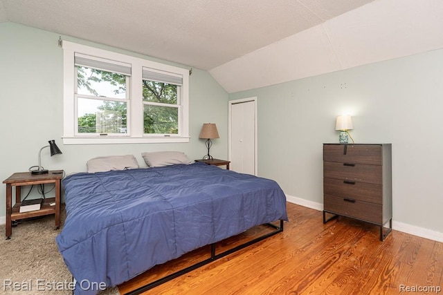 1388 W Troy St, Ferndale, MI 48220 - bedroom featuring vaulted ceiling, wood finished floors, and a closet