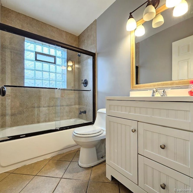 26495 Monticello St, Inkster, MI 48141 - bathroom with vanity, enclosed tub / shower combo, and tile patterned floors