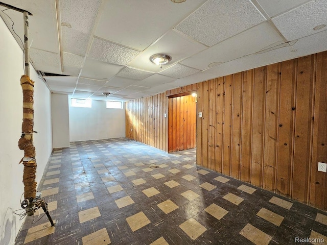 26495 Monticello St, Inkster, MI 48141 - basement featuring tile patterned floors and wooden walls