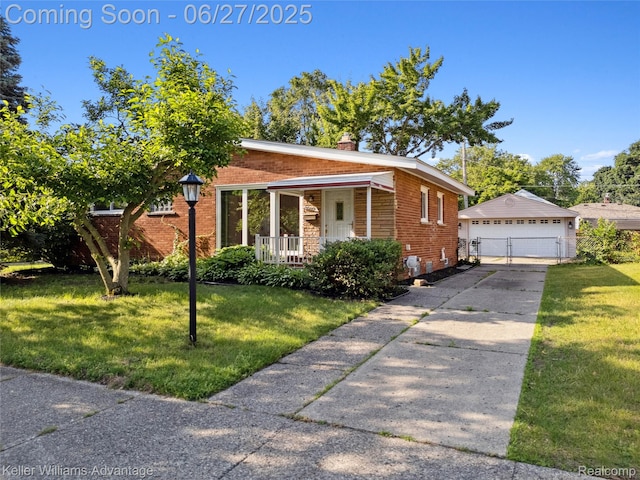 36669 Pinetree St, Livonia, MI 48150 - view of front of property with an outbuilding, brick siding, a front lawn, and a detached garage