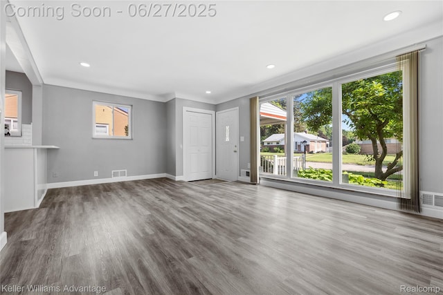 36669 Pinetree St, Livonia, MI 48150 - unfurnished living room with wood finished floors and recessed lighting