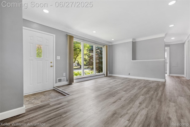 36669 Pinetree St, Livonia, MI 48150 - entryway featuring wood finished floors, recessed lighting, and crown molding