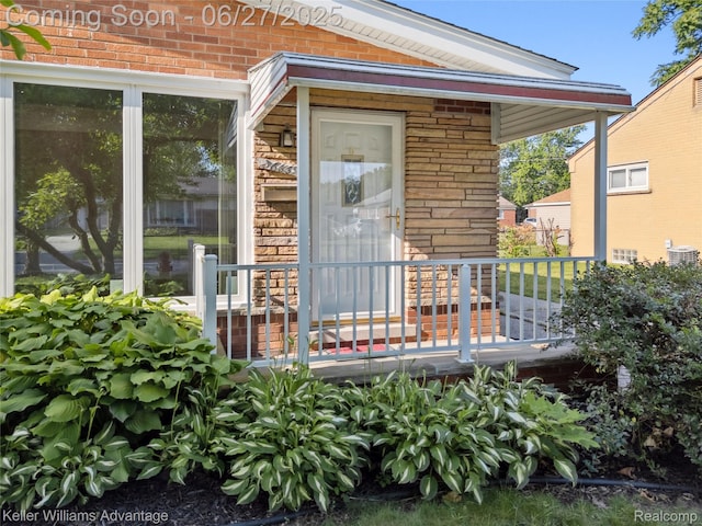 36669 Pinetree St, Livonia, MI 48150 - entrance to property featuring brick siding and a porch