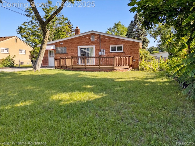 36669 Pinetree St, Livonia, MI 48150 - back of house featuring a chimney, a wooden deck, and brick siding