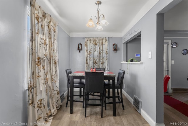 11670 Marlowe St, Detroit, MI 48227 - dining space featuring a chandelier and wood finished floors