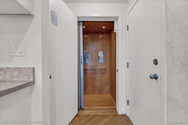 2222 Garland St, Sylvan Lake, MI 48320 - hallway featuring wood finished floors