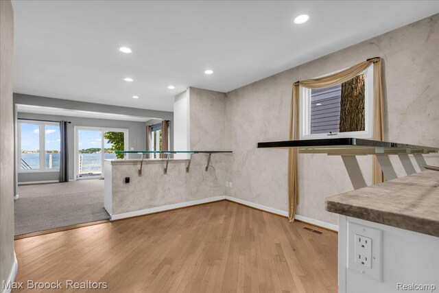 2222 Garland St, Sylvan Lake, MI 48320 - kitchen with a water view, light wood-type flooring, and recessed lighting