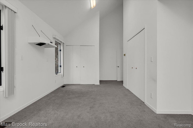 2222 Garland St, Sylvan Lake, MI 48320 - additional living space with carpet flooring and high vaulted ceiling