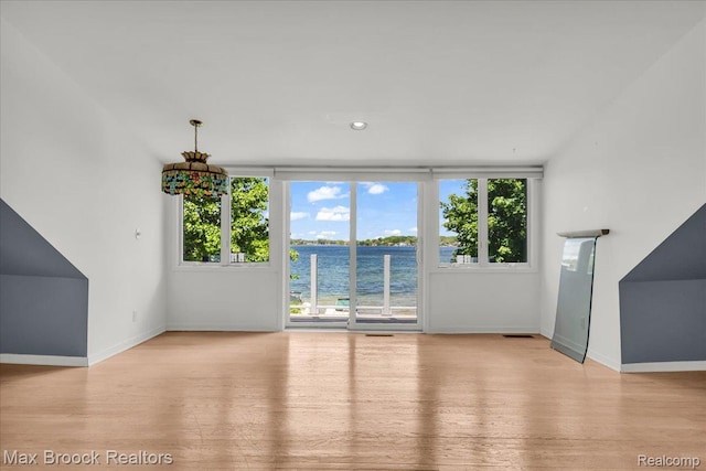 2222 Garland St, Sylvan Lake, MI 48320 - unfurnished living room with wood finished floors and a water view