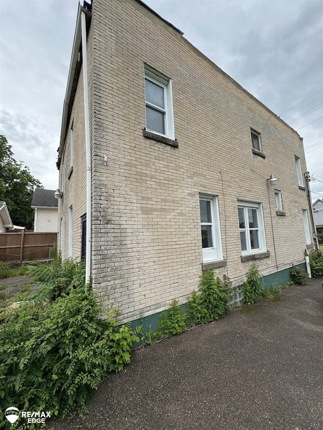 1409 2nd St, Flint, MI 48503 - view of property exterior featuring brick siding