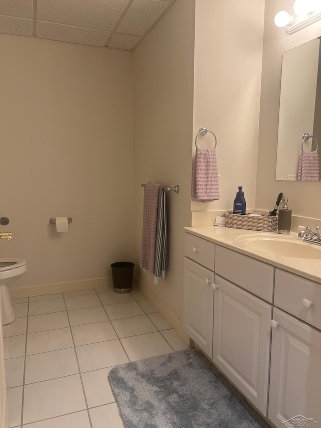 13 E Grove Ct, Freeland, MI 48623 - bathroom featuring tile patterned flooring, vanity, and a paneled ceiling