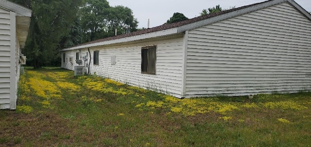 1000 W Lyons St, Mount Pleasant, MI 48858 - view of home's exterior featuring a lawn and a central air condition unit