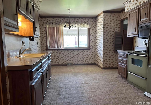 24739 Blackmar Ave, Warren, MI 48091 - kitchen with wallpapered walls, range with electric stovetop, ornamental molding, dark brown cabinets, and a chandelier