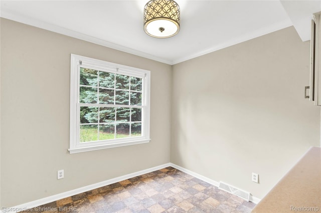 4770 Hedgewood Dr, Bloomfield Hills, MI 48301 - spare room featuring ornamental molding and stone finish floors