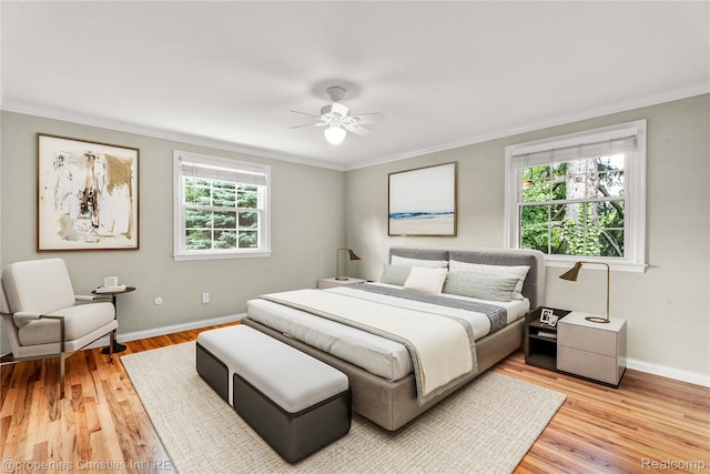 4770 Hedgewood Dr, Bloomfield Hills, MI 48301 - bedroom with multiple windows, ornamental molding, light wood-style floors, and a ceiling fan