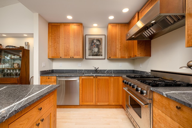 2012 Pontiac Trl, Ann Arbor, MI 48105 - kitchen featuring stainless steel appliances, extractor fan, light wood-style flooring, recessed lighting, and brown cabinets