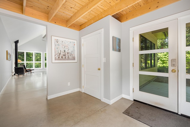 2012 Pontiac Trl, Ann Arbor, MI 48105 - entryway with a wood stove, a wooden ceiling with exposed beams, and concrete floors