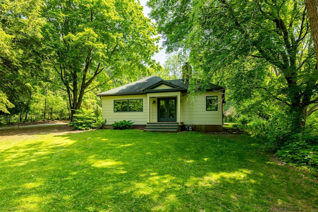 2012 Pontiac Trl, Ann Arbor, MI 48105 - bungalow-style house with french doors, a front yard, and entry steps