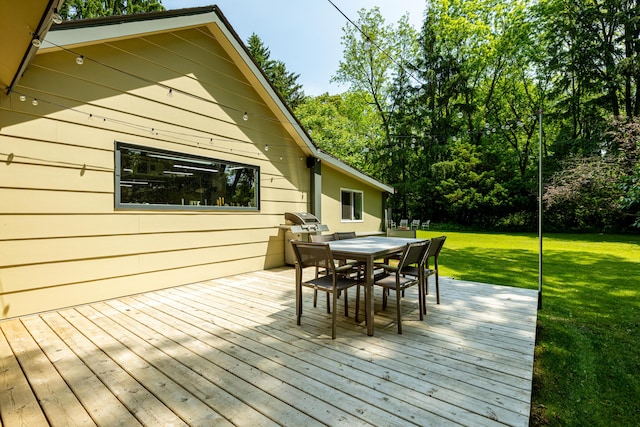 2012 Pontiac Trl, Ann Arbor, MI 48105 - deck with outdoor dining area and a yard