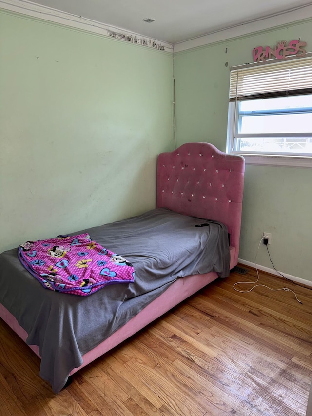 34516 John St, Wayne, MI 48184 - bedroom with wood finished floors and crown molding