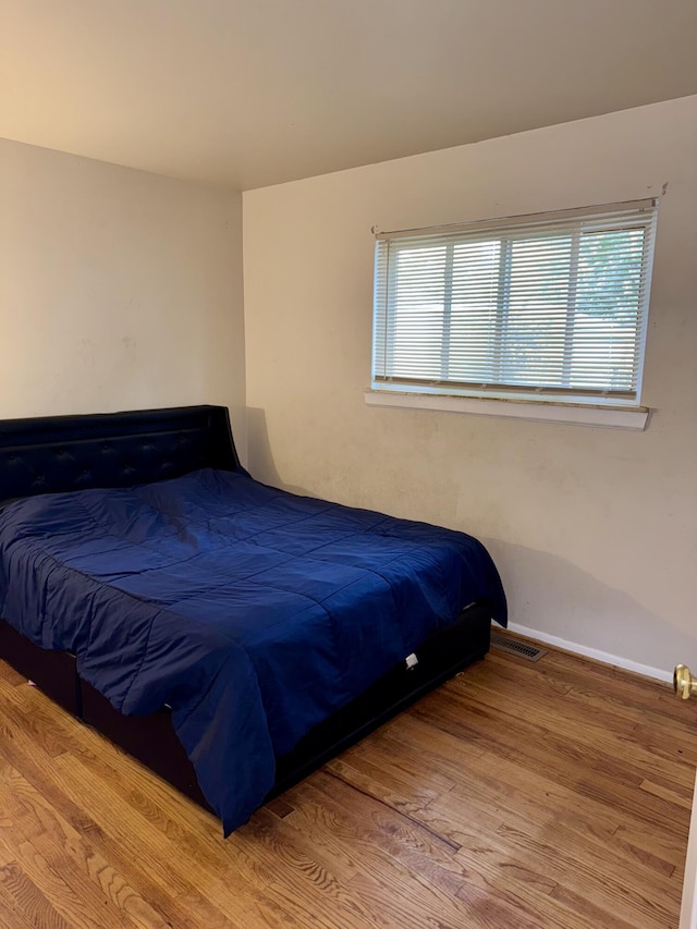34516 John St, Wayne, MI 48184 - bedroom with wood finished floors and multiple windows
