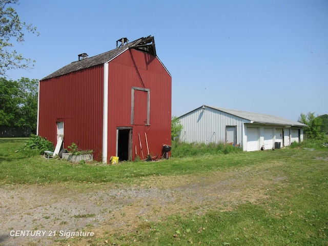 7300 Corunna Rd, Swartz Creek, MI 48473 - view of pole building with a lawn