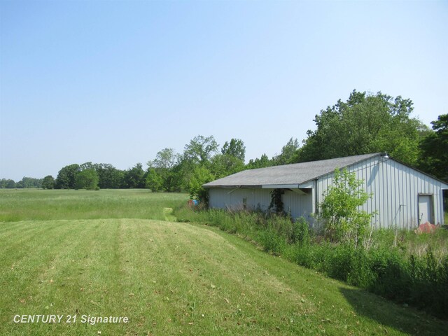7300 Corunna Rd, Swartz Creek, MI 48473 - view of grassy yard with an outbuilding