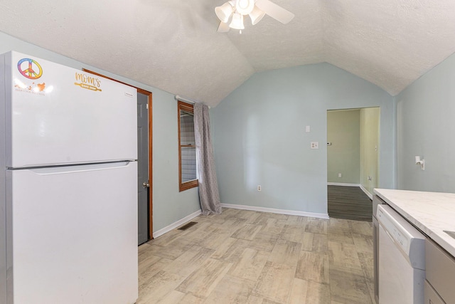 109 N Lincoln Ave, Niles, MI 49120 - kitchen with white appliances, light wood-style floors, a textured ceiling, ceiling fan, and vaulted ceiling