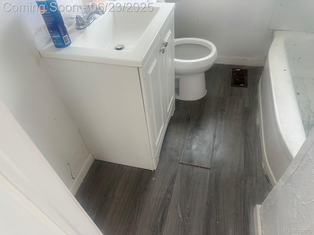 4080 Isabelle St, Dearborn, MI 48141 - bathroom with wood finished floors, vanity, and a bathtub
