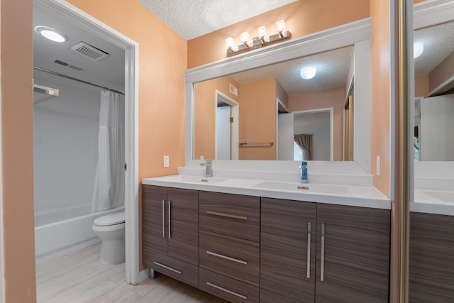 730 Cliffs Dr Unit 304A, Ypsilanti, MI 48198 - bathroom featuring a textured ceiling, double vanity, shower / bath combo, and wood finished floors