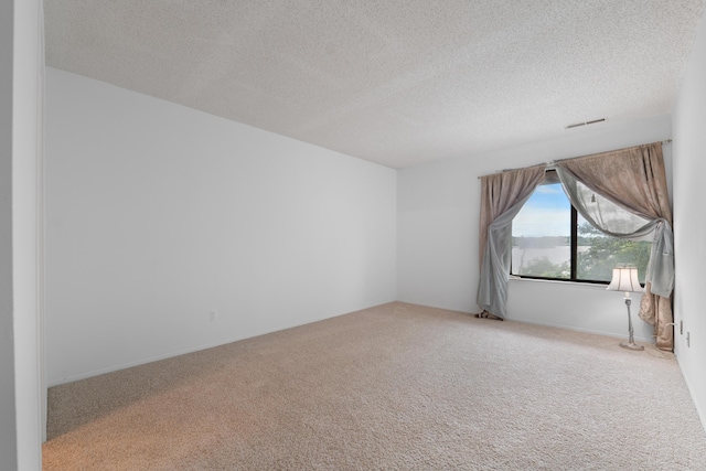 730 Cliffs Dr Unit 304A, Ypsilanti, MI 48198 - carpeted spare room featuring a textured ceiling