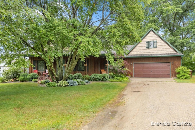 17318 Thunder Bay Ct, Howard City, MI 49329 - view of front facade with dirt driveway, a front lawn, and an attached garage