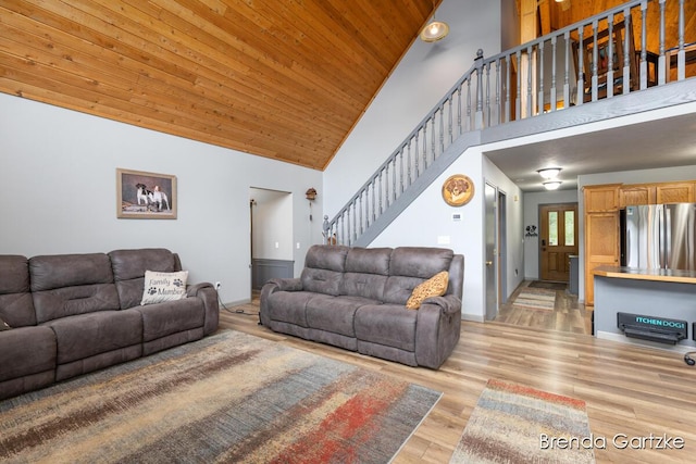 17318 Thunder Bay Ct, Howard City, MI 49329 - living area featuring stairway, high vaulted ceiling, light wood-style floors, and wooden ceiling