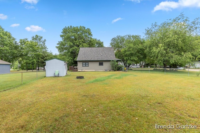 17318 Thunder Bay Ct, Howard City, MI 49329 - fenced backyard featuring an outbuilding