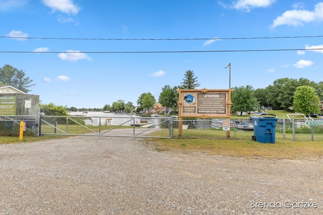 17318 Thunder Bay Ct, Howard City, MI 49329 - view of dirt / gravel driveway featuring a gate and a gated entry