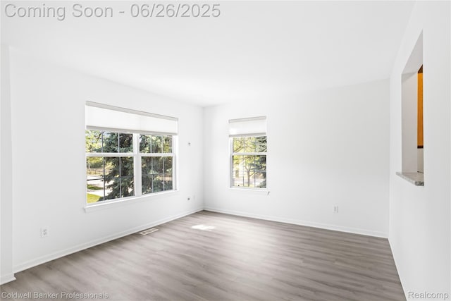 880 Seville Row, Detroit, MI 48202 - empty room with wood finished floors and baseboards