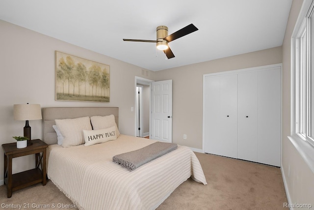 6262 Garden Ct, Warren, MI 48091 - bedroom with light carpet, a closet, and a ceiling fan
