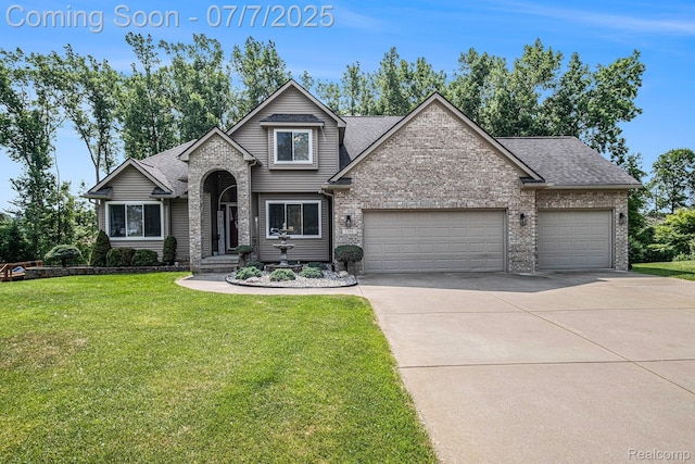 2390 Torrey Grove Ct, Fenton, MI 48430 - view of front of home with an attached garage, driveway, brick siding, and a front yard