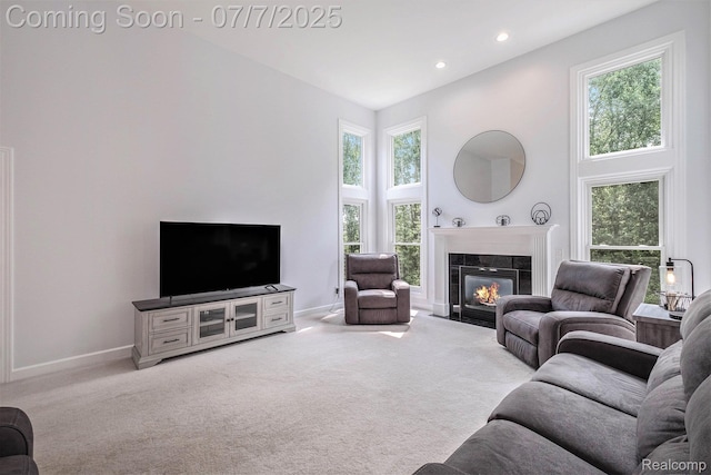 2390 Torrey Grove Ct, Fenton, MI 48430 - carpeted living room featuring plenty of natural light, a tiled fireplace, recessed lighting, and a towering ceiling
