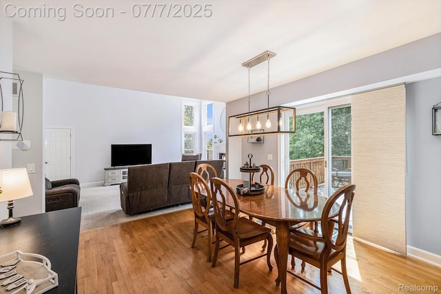 2390 Torrey Grove Ct, Fenton, MI 48430 - dining space with light wood-style floors and a chandelier