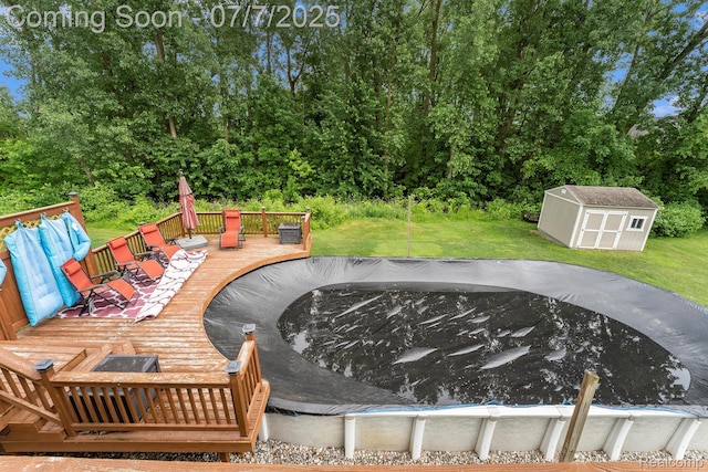 2390 Torrey Grove Ct, Fenton, MI 48430 - view of patio / terrace featuring a deck, a storage unit, and a covered pool