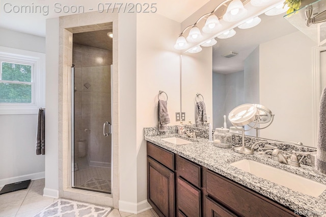 2390 Torrey Grove Ct, Fenton, MI 48430 - bathroom with double vanity, a shower stall, and tile patterned floors