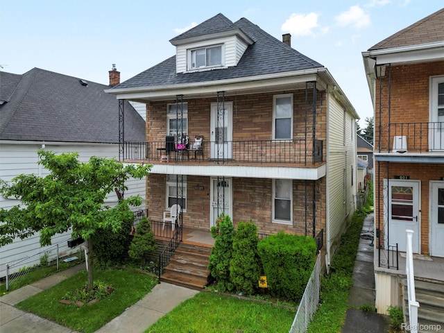 11727 Fleming St, Hamtramck, MI 48212 - view of front of home with a balcony, a porch, a chimney, and roof with shingles