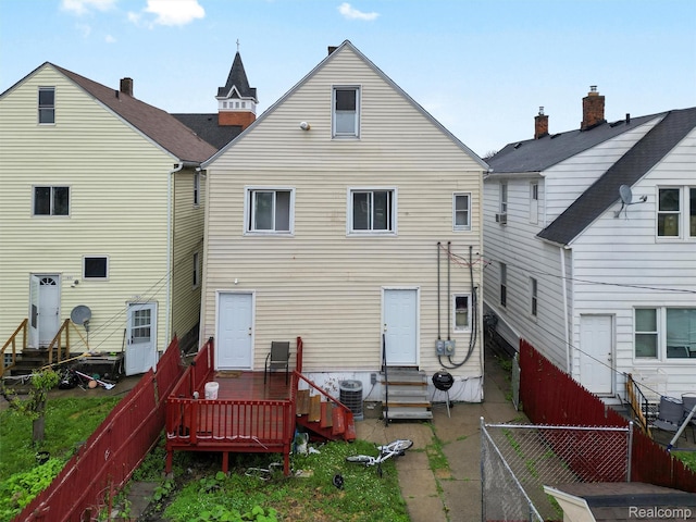 11727 Fleming St, Hamtramck, MI 48212 - back of property with entry steps, a fenced backyard, and a deck