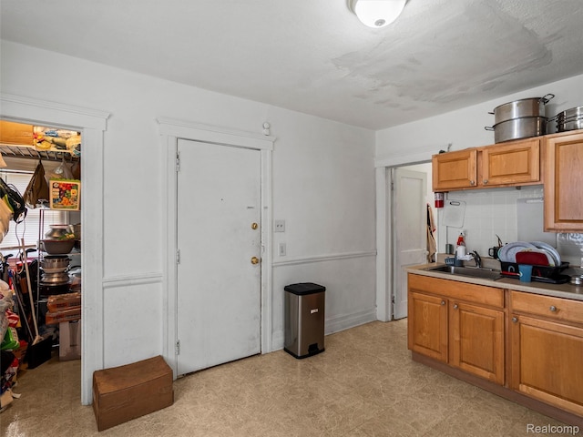 11727 Fleming St, Hamtramck, MI 48212 - kitchen featuring light flooring, light countertops, and tasteful backsplash